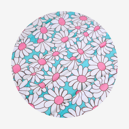 Round fabric cover with white daisy pattern on a blue background