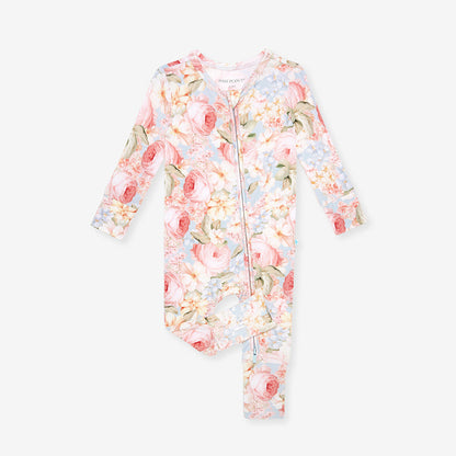 Floral patterned one piece with pink and white flowers on a light blue background