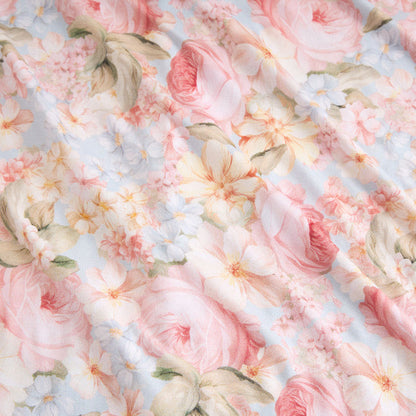 Floral pattern with pink and white flowers on a light blue background