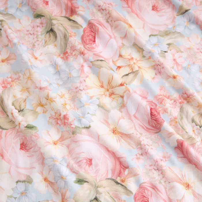 Floral pattern with pink and white flowers on a light blue background