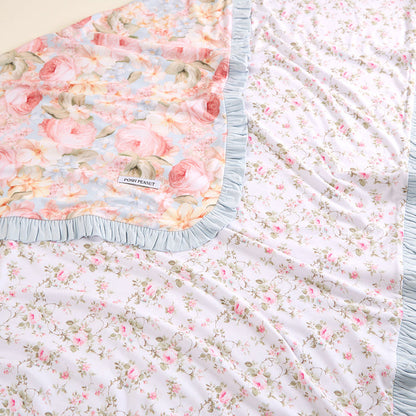 Floral patterned fabric with a brand label on a beige background