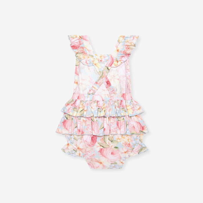 back image of floral romper with criss cross detail