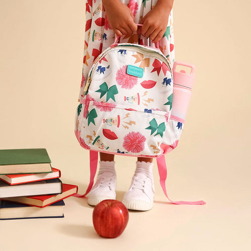 Child with a colorful backpack and water bottle on a beige background