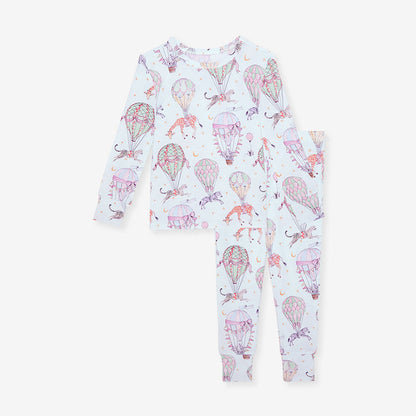 Children's pajama set with hot air balloon and elephant pattern on a white background