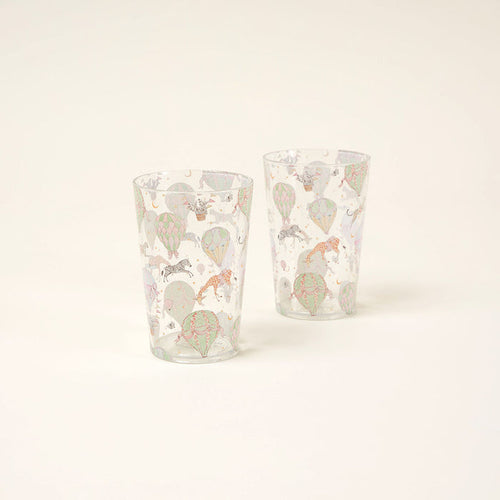 Two clear glasses with colorful animal illustrations on a white background