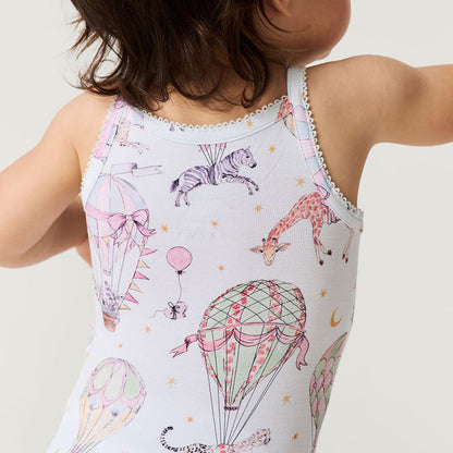 Child wearing a sleeveless bodysuit with animal and hot air balloon print on a plain background