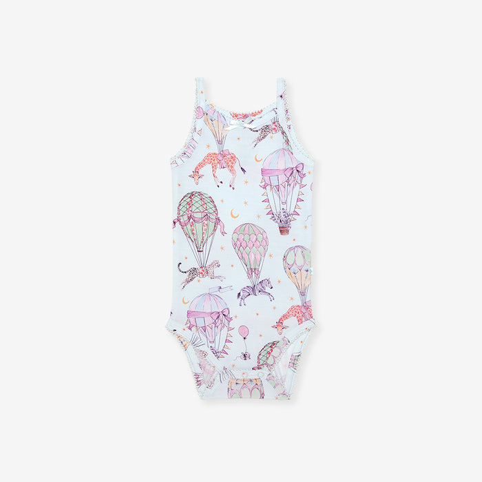 One-piece bodysuit with hot air balloon and unicorn pattern on a white background