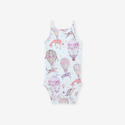 One-piece bodysuit with hot air balloon and unicorn pattern on a white background
