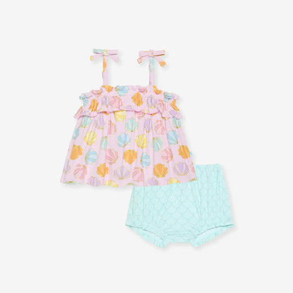Pastel shell patterned top with matching bloomers on a white background