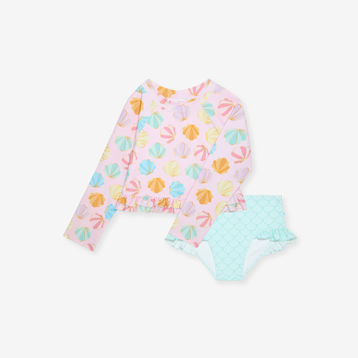 Baby outfit with mint green bottoms on a white background