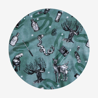 Circular design with black and white illustrations on a teal background