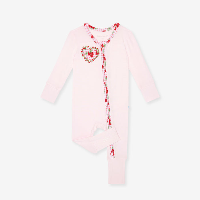 bamboo viscose one piece with solid light pink fabric and strawberry printed side applique, on a white background