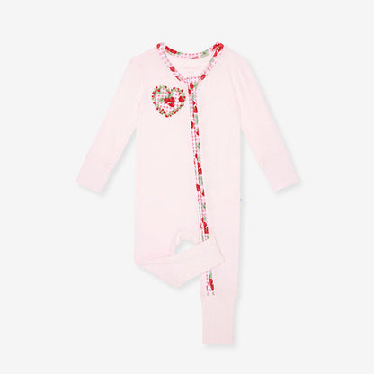 bamboo viscose one piece with solid light pink fabric and strawberry printed side applique, on a white background