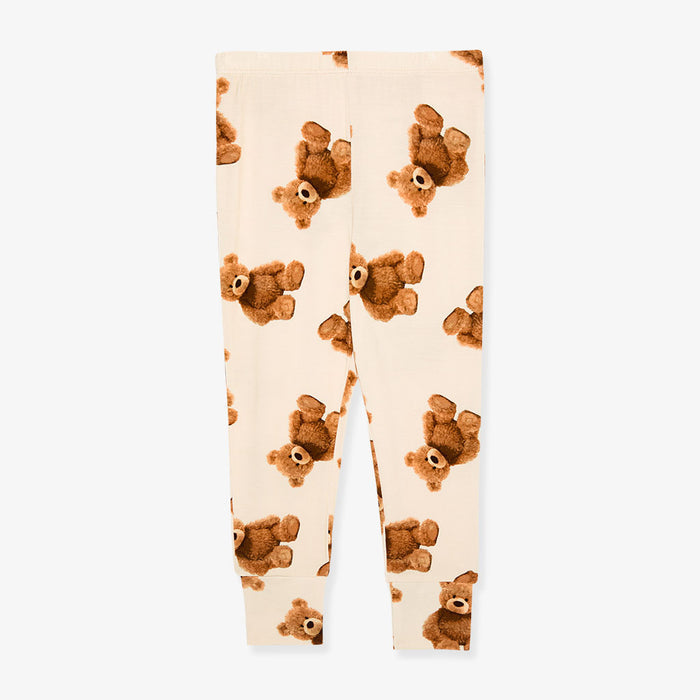 Leggings with teddy bear pattern on a beige background
