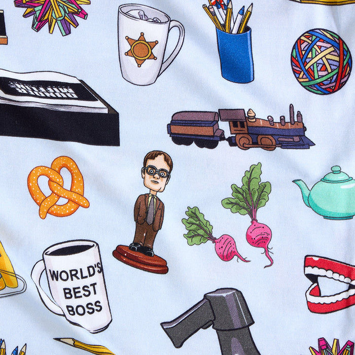 fabric closeup with various illustrations from The Office television show including a person, coffee cup, train, and pretzel on a light blue background