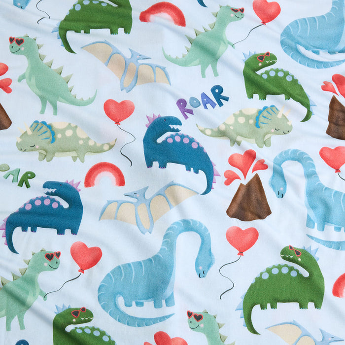 Pattern of colorful dinosaurs and heart balloons on a light blue background